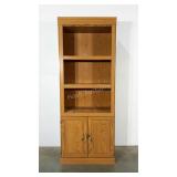 Laminated bookcase with storage below.