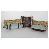 Throw pillow lot: Blue and brown pillows show the