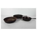Three cast iron skillets