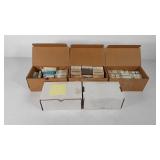 Five boxes of uncut glass lenses