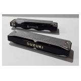 Two harmonicas Bushman and Suzuki