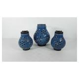 Three ceramic hanging lanterns, one is missing