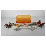 Storage bin of toys, includes dinosaurs and