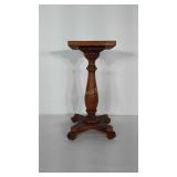 Wooden plant stand. Wobbles due to feet being