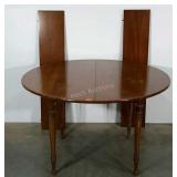 Round table with two leaf extensions. 48"