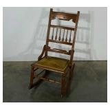 Rocking chair, velour seat pad, primitive carved