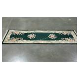 Wool runner rug. Dark green with ivory and floral