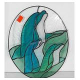 Leaded glass window hanging of dolphins. Measures