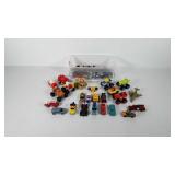 Small storage bin full of toy cars, cars include