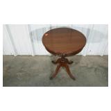 Accent table with metal claw feet, lion drawer