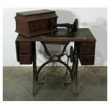Early sewing table with Singer machine, age wear