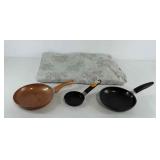 Floral tablecloth, omelette pans and egg pan