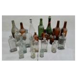 Group lot of vintage liquor and medicine bottles.