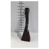 Old cow bell on leather strap