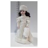 Porcelain doll dress in winter clothes