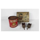 Two Advertising tins and two ceramic cable guides