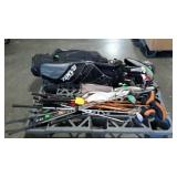 Skid lot of golf clubs, bag and umbrella. This