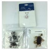 Two turtle brooches and a 18in turtle necklace