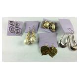 Five pairs of earrings, gold plate and