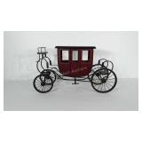 Wooden carriage with metal frame. Measures 27"