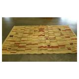 Area rug in neutral geometric pattern.  79"×114".