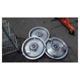 Three Lincoln Hub Caps plus 3 American Racing