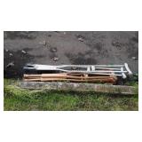 Three pairs of crutches, one are aluminum