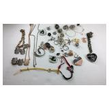 Assorted jewelry, necklaces, earrings, rings, and