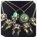 Three statement necklaces with green stones