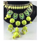 Three statement necklaces with green stones