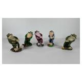 Frog statues, five, all look like the are pulling