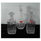 Three glass decanters, 10" and 13"