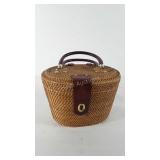 Wicker basket with hinged lid, lock, and dual