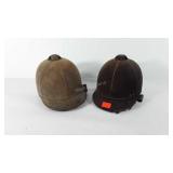 Two equestrian riding helmets
