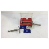 Three razors with extra blades