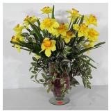 Everlasting daffodil floral arrangement in glass