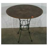 Metal table, copper look patina on a green