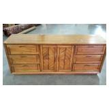 Solid wood, nine drawer dresser. Has some finish