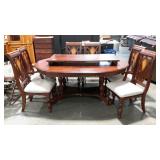 Table with six chairs and a large leaf. Inlay