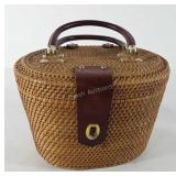 Wicker basket with hinged lid, lock, and dual