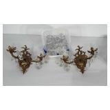 2 brass sconce light fixtures with glass prisms.