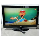 LG  32" flat screen TV on stand with remote.