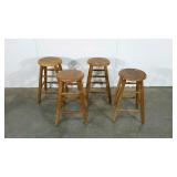 Four stools, one is missing a stretcher