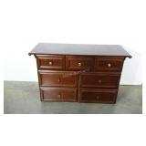 Seven drawer dresser with sports ball pulls.