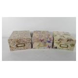 Three decorative storage boxes full of greeting