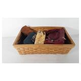 Basket of purses, handbags, and wallets, includes