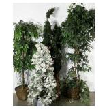 A forest of assorted artificial trees. Some