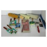 Group of painting supplies, includes rollers,