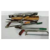 Kitchen trash can full of miscellaneous tools,