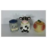 Three cookie jars, all have cracks or chips as